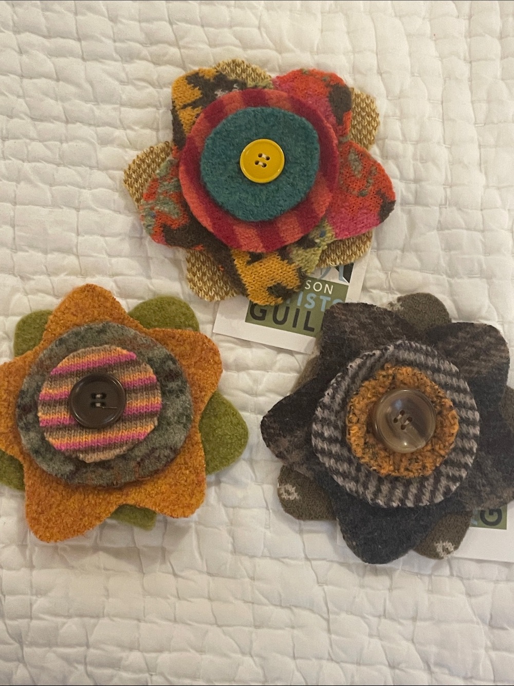 Lapel pins made from wool fabric 5” diameter.